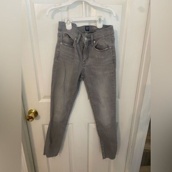 Denim - - Woman’s distressed bottom true skinny grey jeans size 2‎